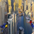 Thrilling view of XLine Dubai Marina, the world’s longest urban zipline, with riders soaring above skyscrapers and the vibrant Dubai Marina waterfront.