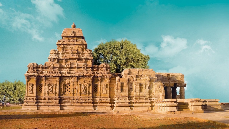 Pattadakal temple complex in Karnataka featuring UNESCO World Heritage Chalukyan architecture with intricately carved stone temples under a clear sky.