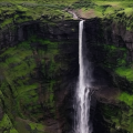 Aerial view of Kalu Waterfall cascading down steep green cliffs in Malshej Ghat, Maharashtra during monsoon.