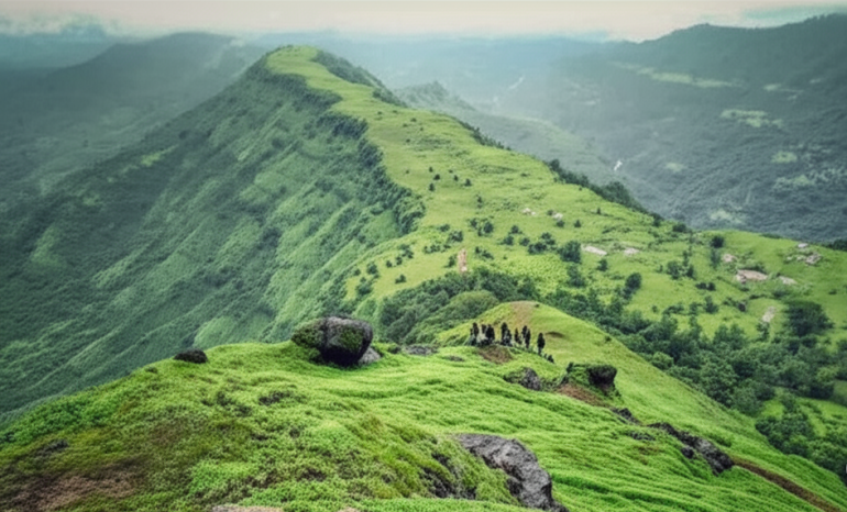 Trekking group on lush green Garbett Plateau during monsoon season near Matheran, Maharashtra.