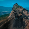 Aerial view of Rajmachi Fort in the Sahyadri hills surrounded by dense forest and scenic mountain ranges.