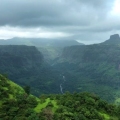 Monsoon view from Sudhagad Fort with lush green valleys and cloudy sky in Raigad, Maharashtra